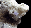 Mineral specimen: Fluorapatite (purple) on Quartz, Albite from Harvard Quarry, Greenwood, Maine.